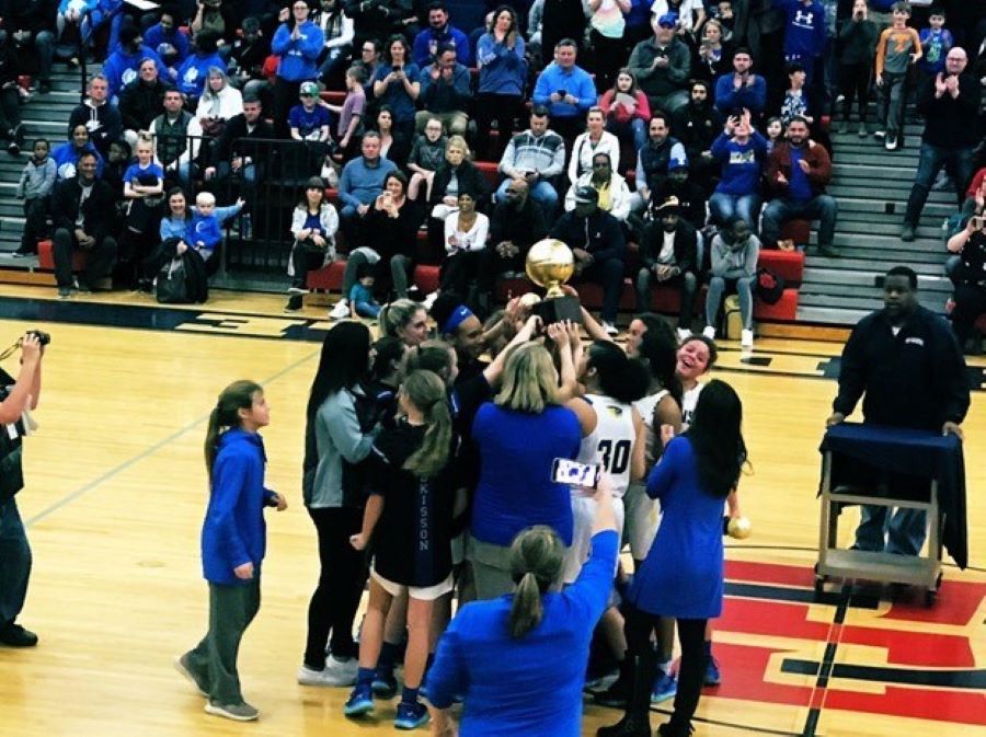 The+Karns+Middle+School+girls+basketball+team+celebrate+their+tournament+win