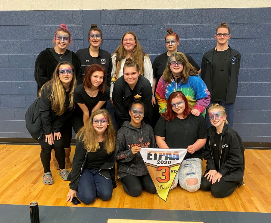 Members of the Karns High Winterguard Smile after winning gold at a recent competition.