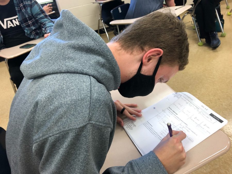 Ethan Fike practices for his final exam during one of the strangest semesters in KHS history.