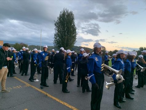 Band members get ready to march to the football field for their parent performance.