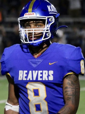 Desean Bishop on the field in blue and gold for the Beavers