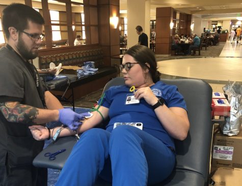 Community members participate in a local blood drive