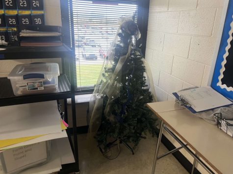 A Christmas tree sits by a classroom window, but does it mean the same thing to all students?