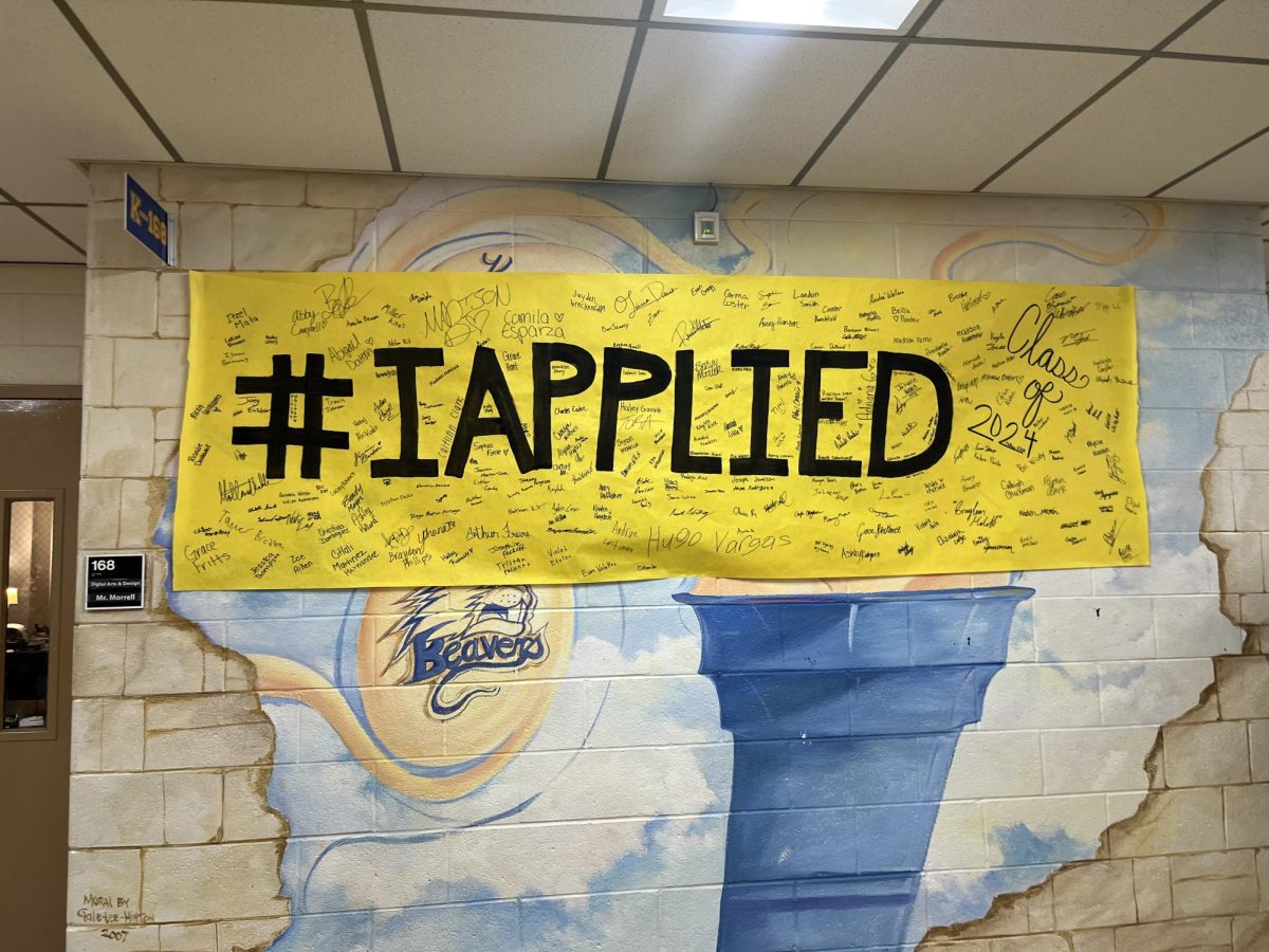 KHS Seniors Sign the #IApplied poster after applying for college.