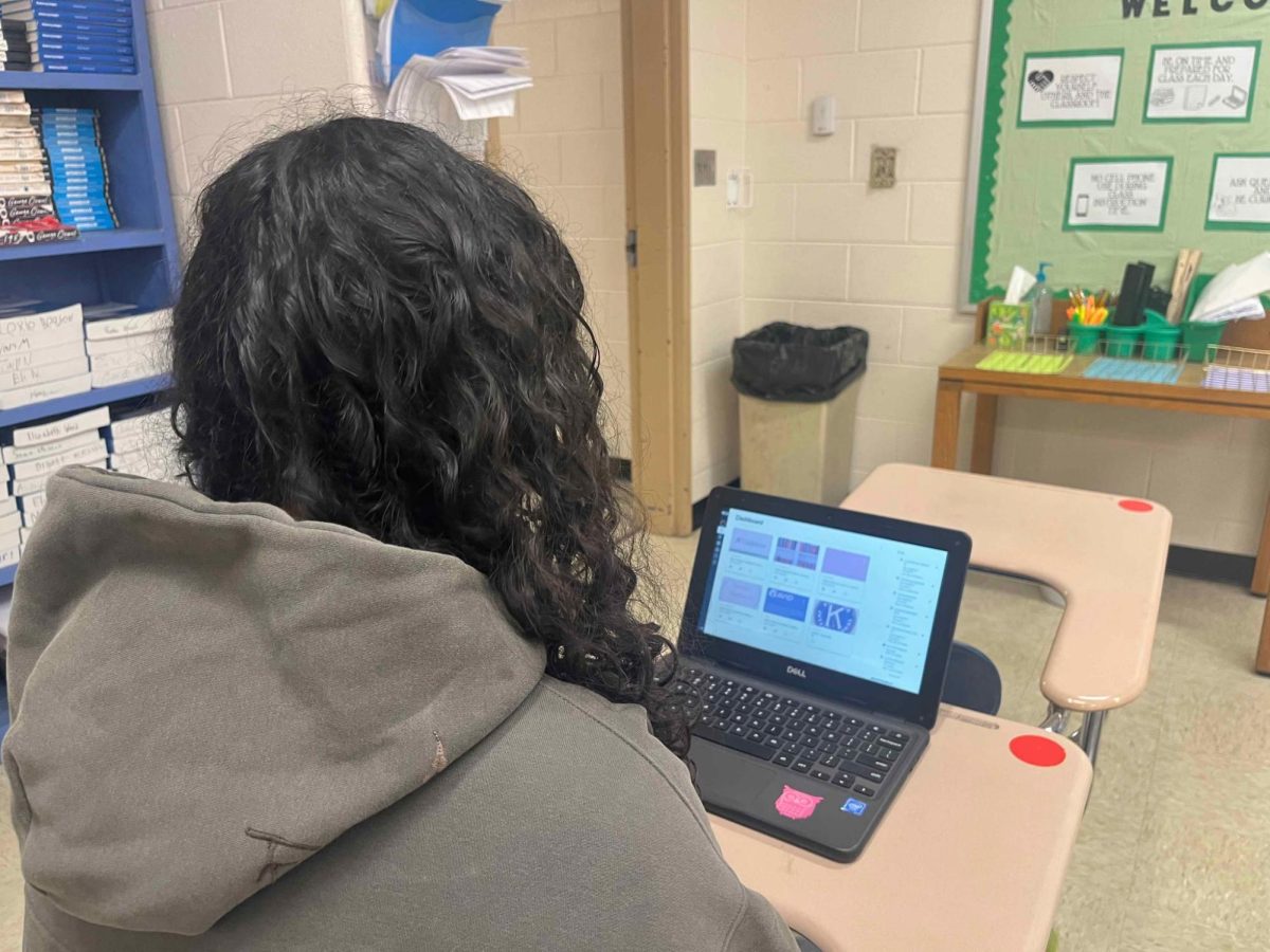 A student opens her Canvas platform to check assignments from her online instructor.