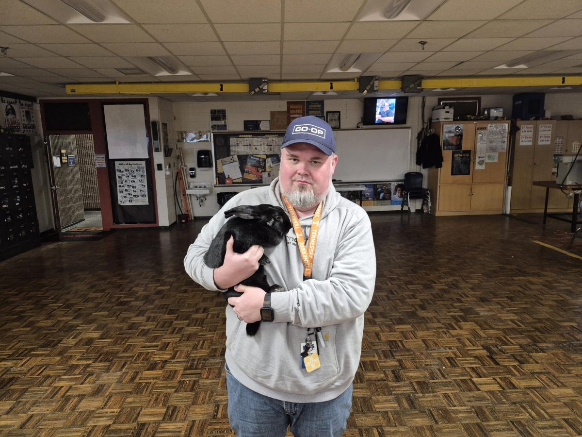 Mr. Cameron shows off one of the animals from his Agriculture Science program.