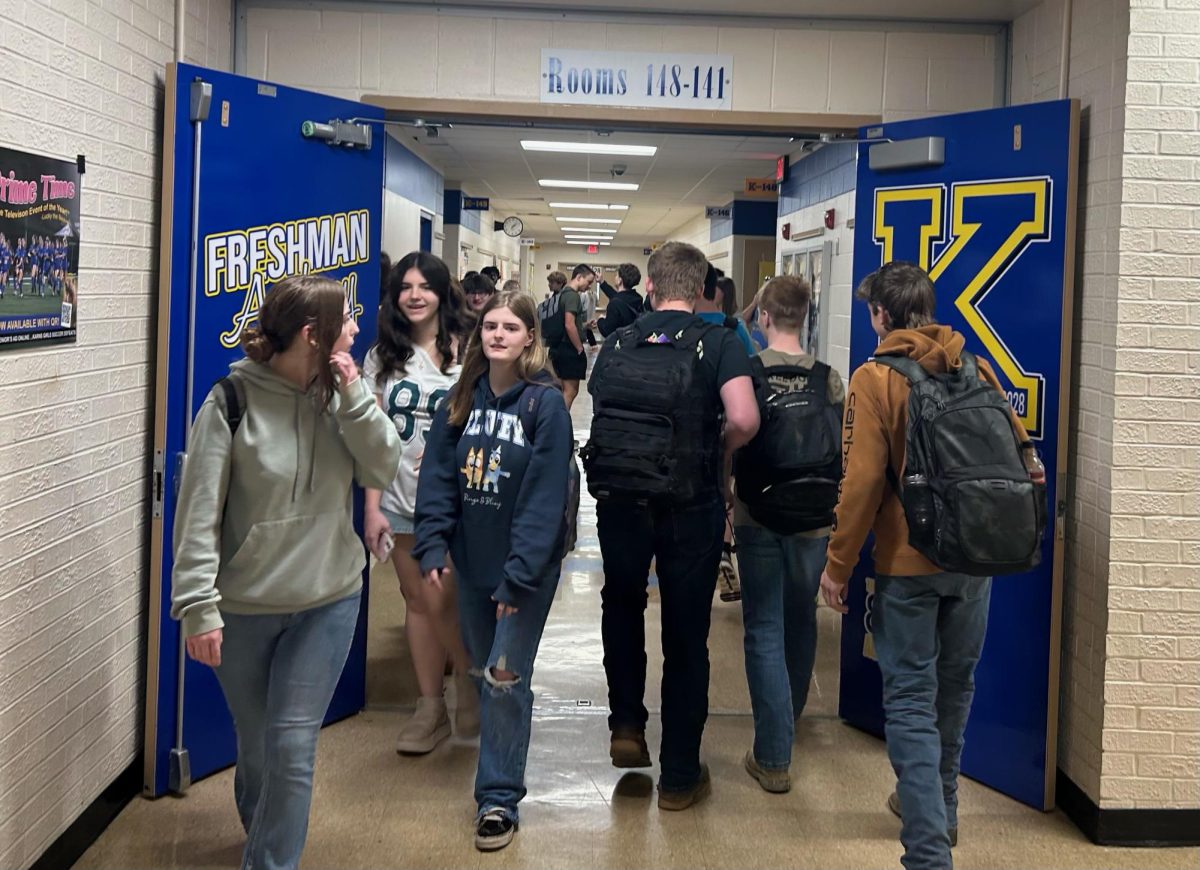 Students from the Class of 2028 walk through the doors to the freshmen academy.