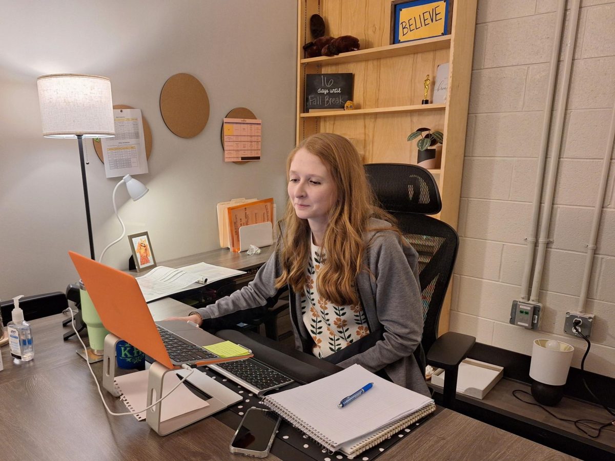 Ms. Reynolds gets some work done in her new office in the Freshman Academy wing. 