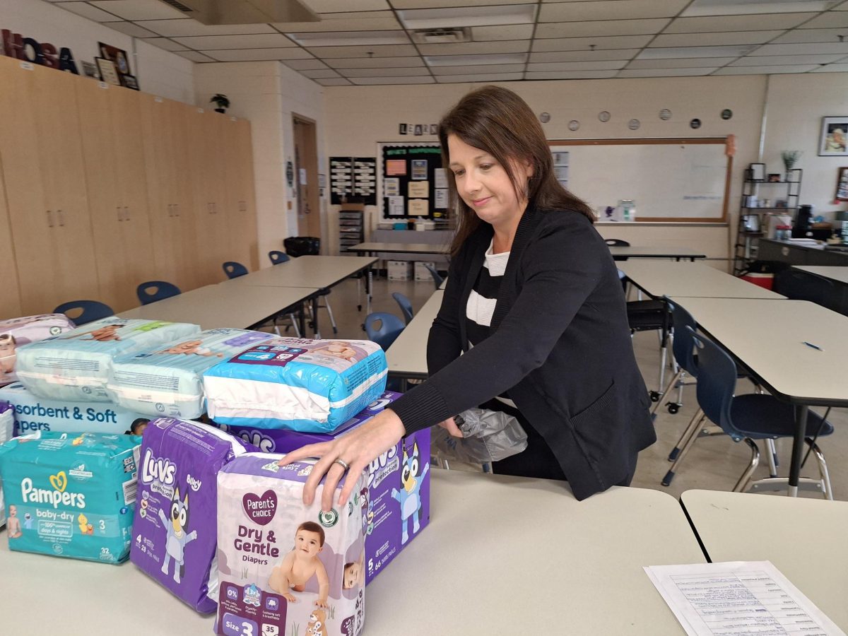 Mrs. Popa organizes diaper donations from HOSA's diaper drive. 