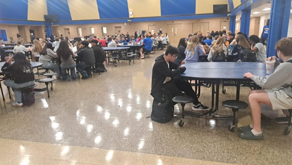 Students enjoy talking with their friends in the commons on a September morning. 