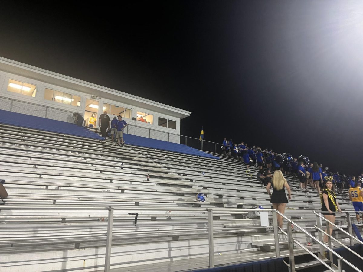 NHS members make sure the stands are spotless after football games. 
