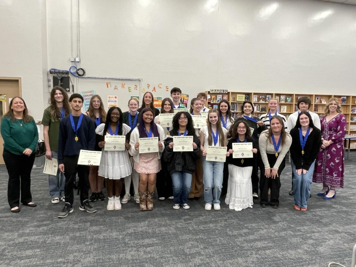 This year's National English Honors Society members pose for a photo at their induction ceremony. 