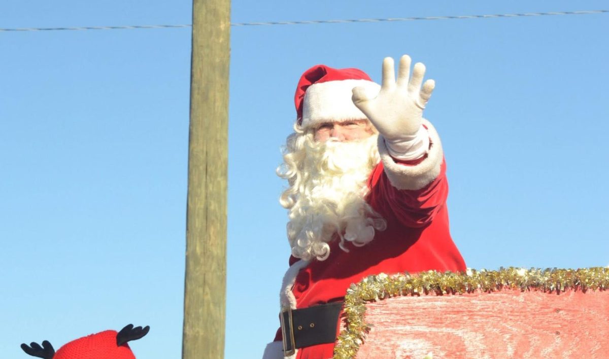 Santa waves from his sleigh at the end of the 2025 Karns Community Christmas Parade.