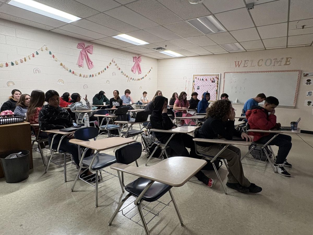 Students complete final exams in metal desks that many find to be uncomfortable. 